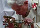 Image of Pope Benedict XVI breathing on the Holy Chrism as a sign of the Holy Spirit